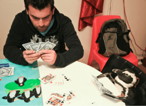 Playing poker with my newly stuffed penguin...